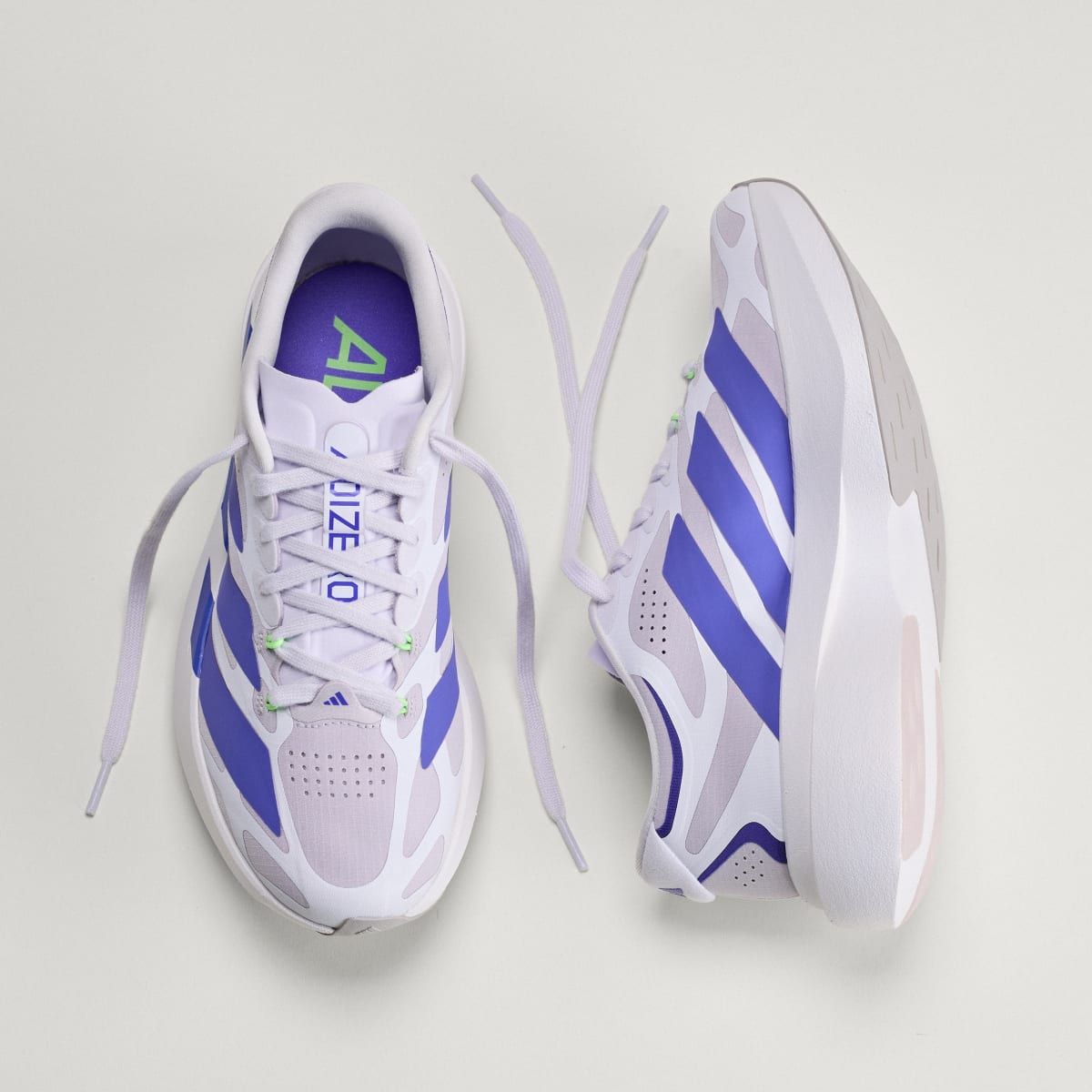 Adidas Adizero Evo SL EXO women's running shoe in Silver Dawn/Solar Purple/Frozen Purple — top and opposite side views