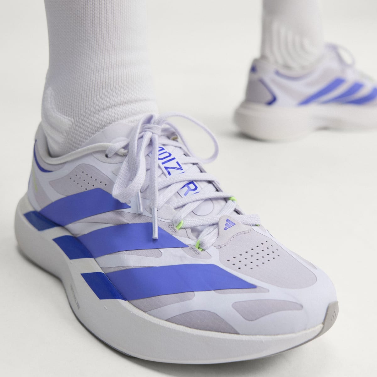 Adidas Adizero Evo SL EXO women's running shoe in Silver Dawn/Solar Purple/Frozen Purple — upper and lacing detail