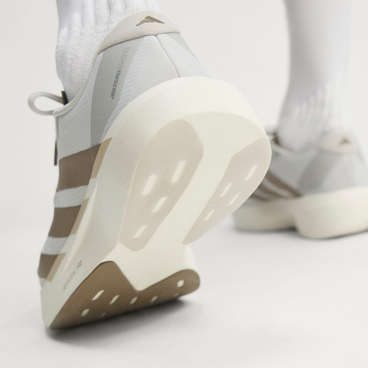 Adidas Adizero Evo SL Woven men's running shoe in Grey One/Grey One/Khaki Six — heel and outsole detail