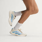 Adidas Adizero Evo SL Woven women's running shoe in Off White/Light Blue/Off White — on-foot side view
