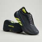 Adidas Hyperboost Edge men's running shoe in Carbon/Hi-Res Yellow/Grey Five — angled pair with outsole visible