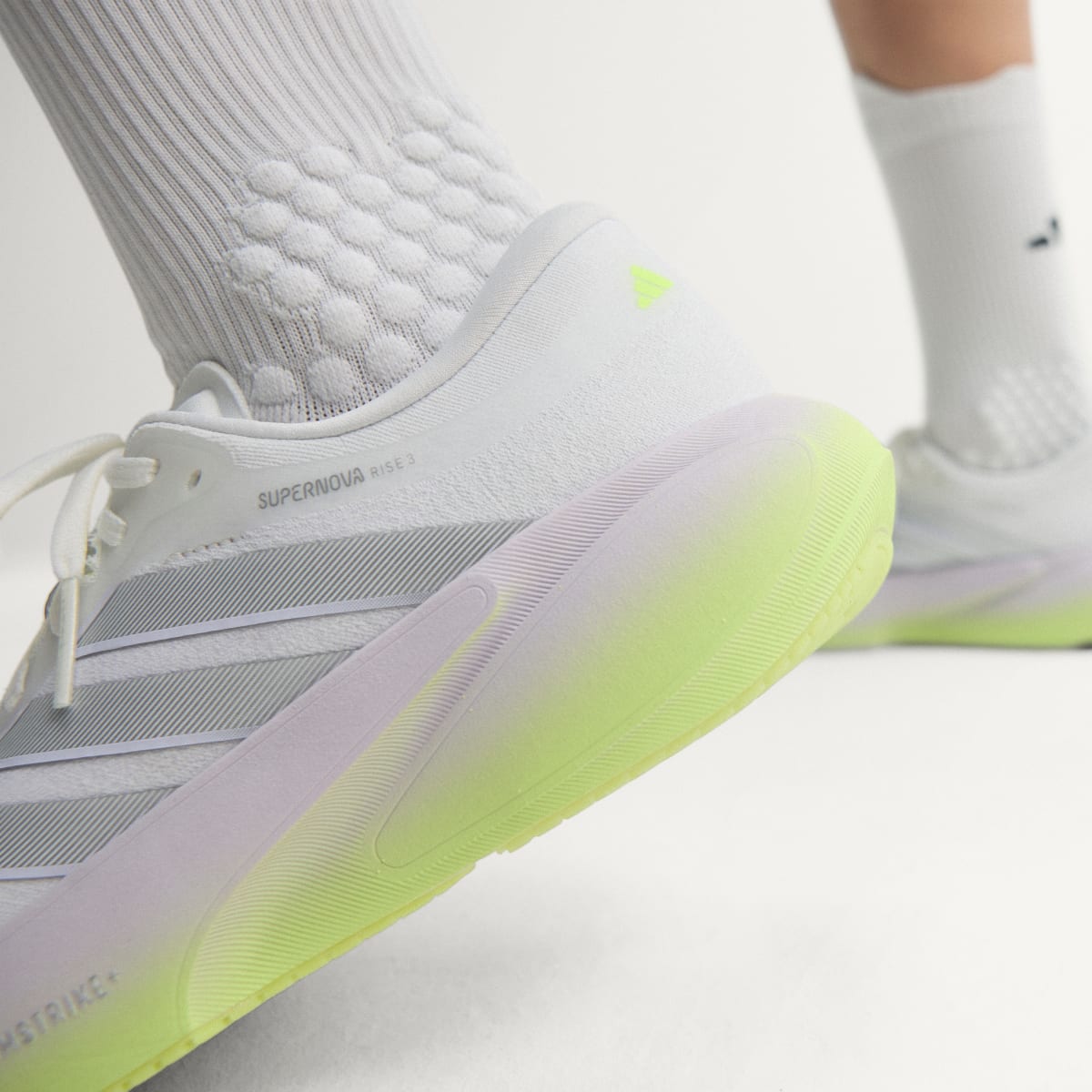 Adidas Supernova Rise 3 women's running shoe in Crystal White/Silver Metallic/Purple Tint — heel and midsole detail