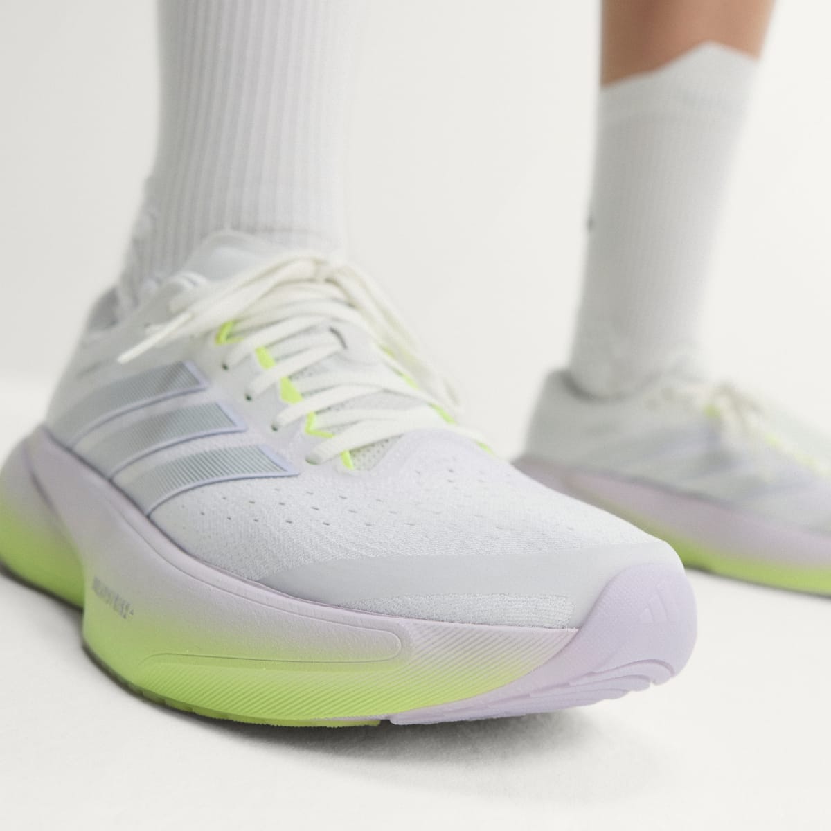 Adidas Supernova Rise 3 women's running shoe in Crystal White/Silver Metallic/Purple Tint — forefoot and lacing detail