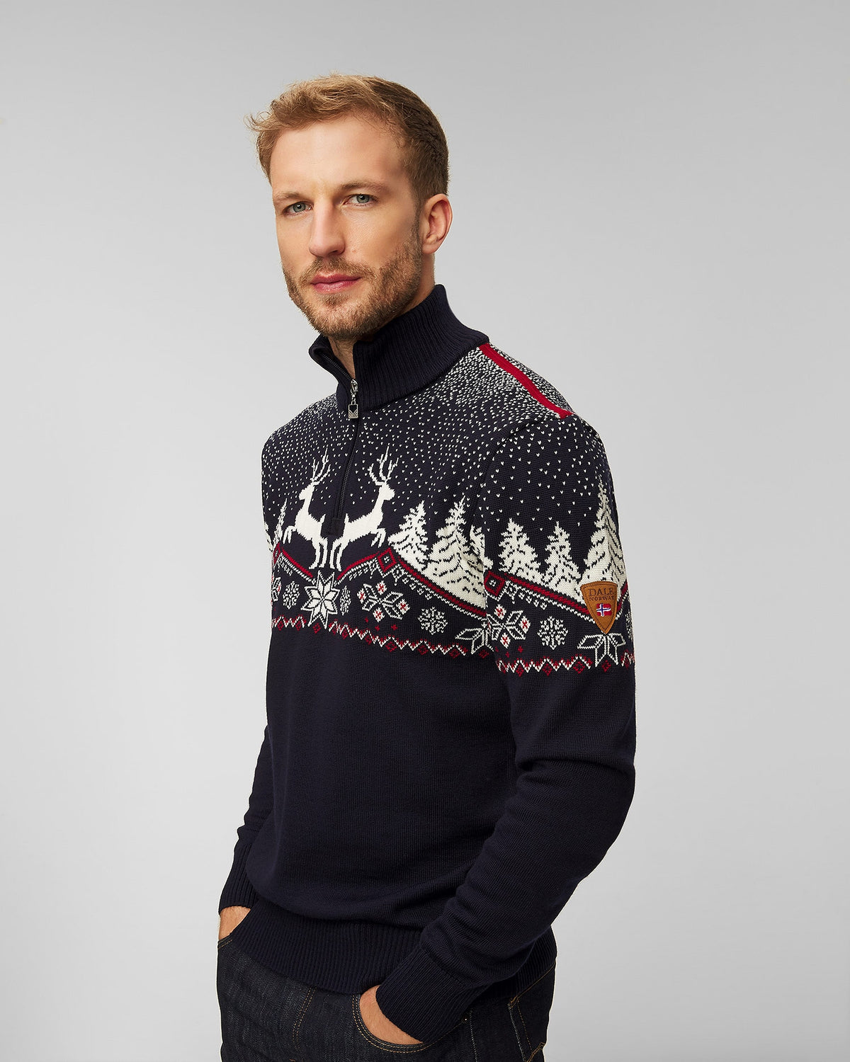 Dale of Norway Christmas Sweater, men’s, Navy/Off White/Raspberry – angled front on model