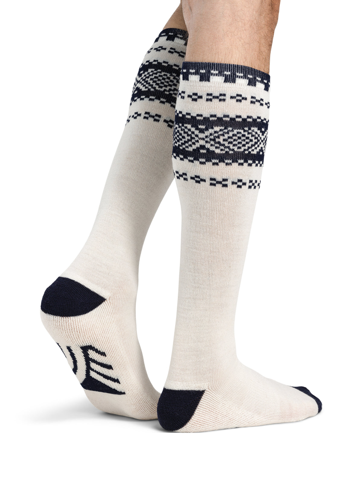 Dale of Norway Cortina unisex knee socks in off-white and navy, pair shown on legs