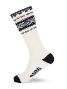 Dale of Norway Cortina unisex knee socks in off-white and navy, single sock showing the tall cuff, heel and toe
