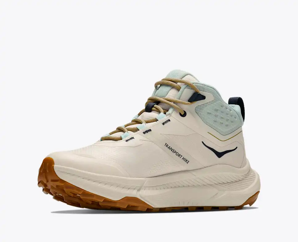 HOKA Transport Hike GTX women's hiking shoe in Alabaster/Glimmering Blue, angled side view