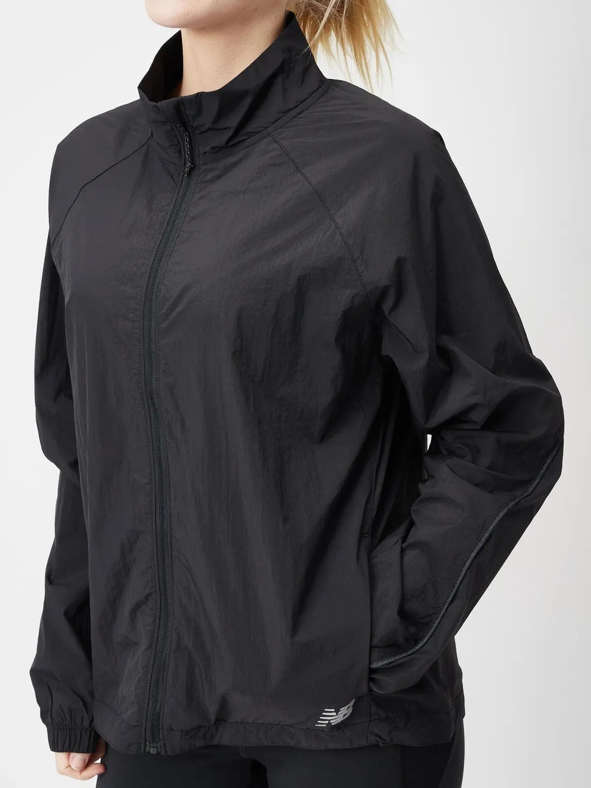 New Balance women's Impact Run Jacket in Black, angled front view