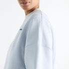 Woman wearing New Balance Sydney Levrone Athletics Crafted Crew in Fresh Air side view