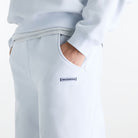 Woman wearing New Balance Sydney Levrone Athletics Crafted Pant in Fresh Air side view