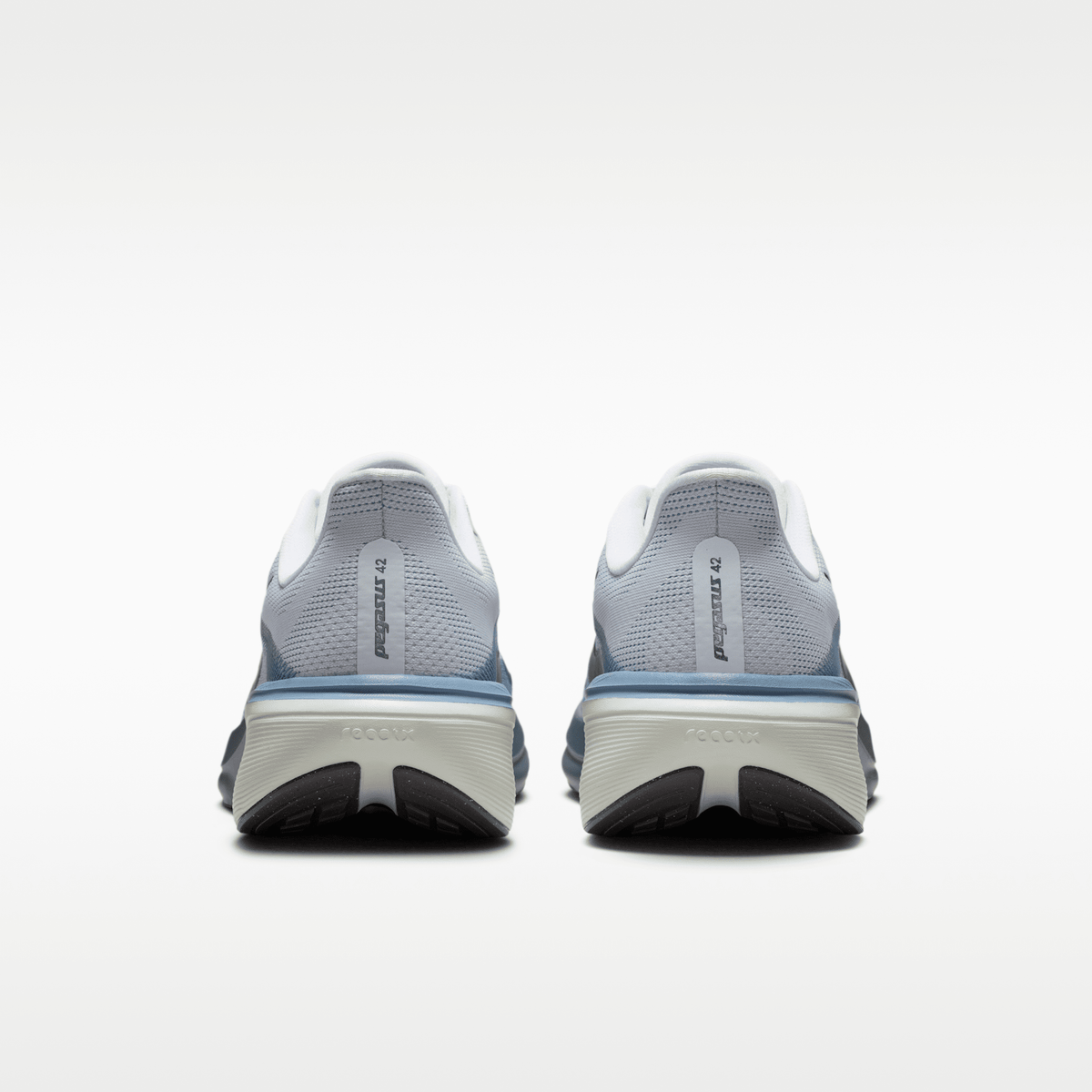 Nike Pegasus 42 men’s shoes in Pure Platinum/Dark Obsidian/Work Blue — rear view of the pair.