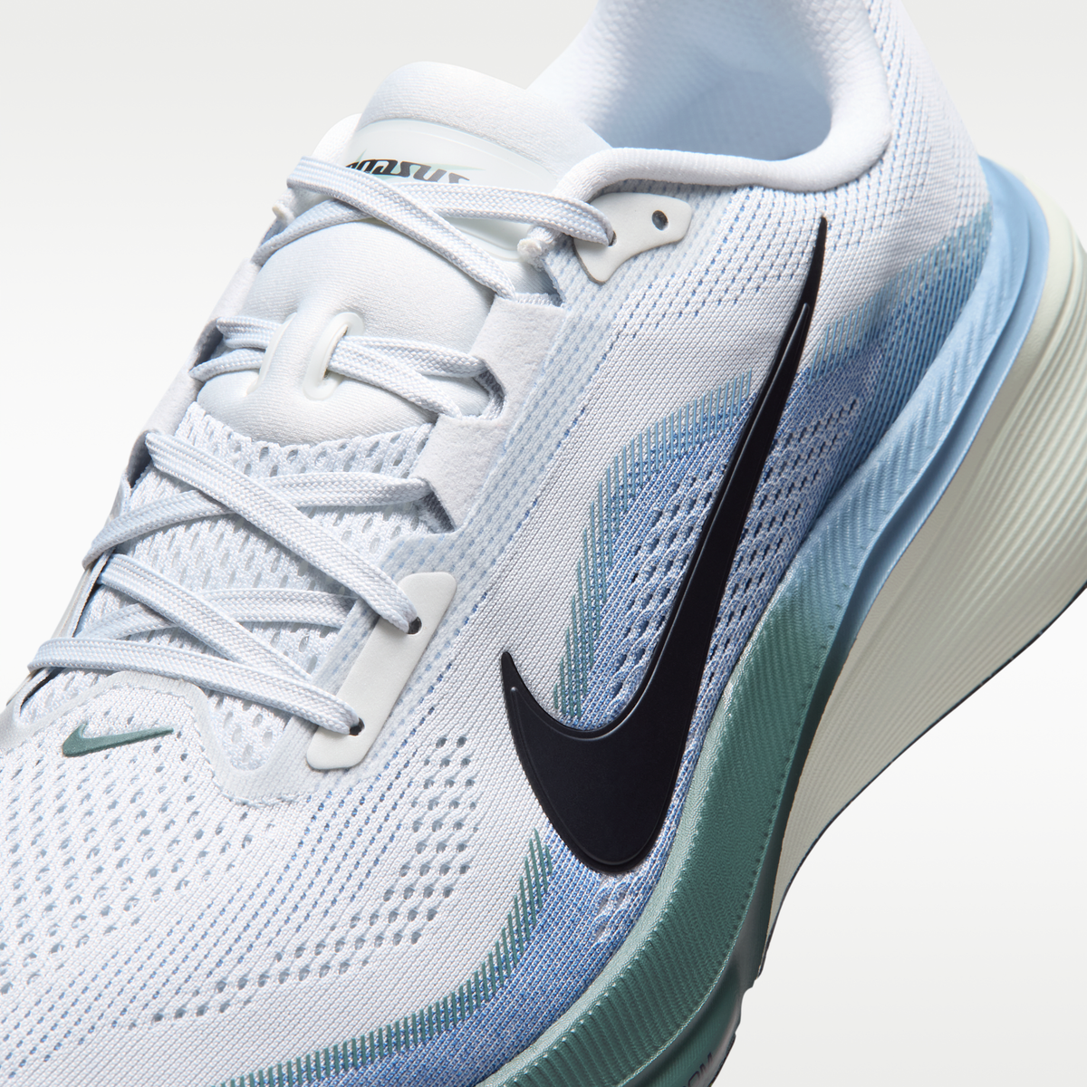 Nike Pegasus 42 men’s shoes in Pure Platinum/Dark Obsidian/Work Blue — upper and lace detail.