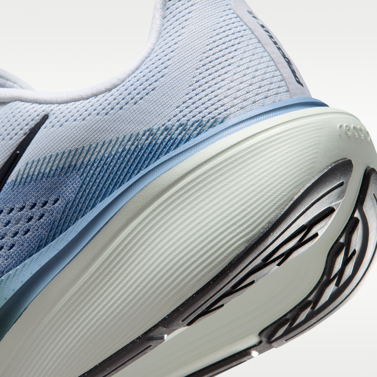 Nike Pegasus 42 men’s shoes in Pure Platinum/Dark Obsidian/Work Blue — heel and midsole detail.