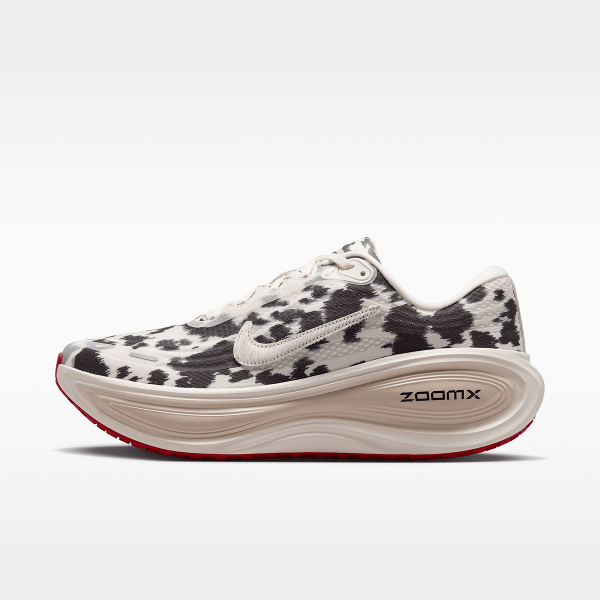 Nike Vomero Plus men's shoes in Sail/Black/University Red with animal-print upper — side profile.