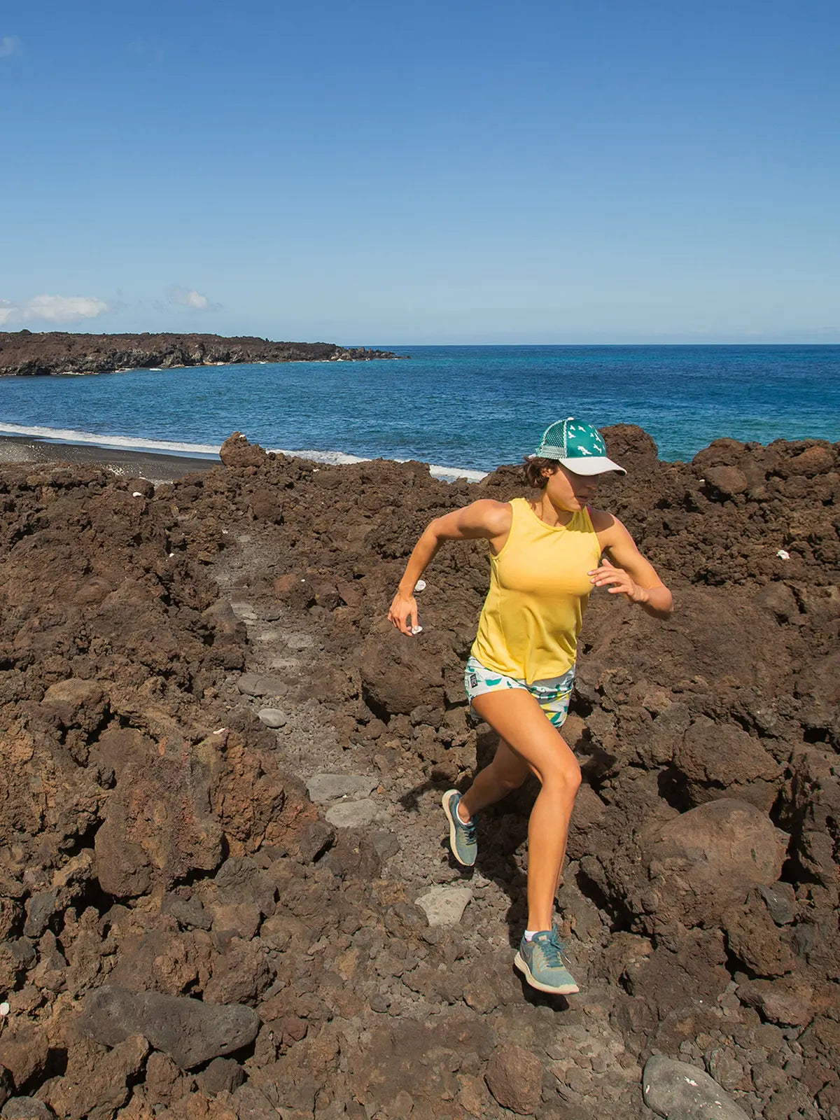 Women's Oiselle Flyout Trail Tank in Lemon/White, full-body trail-running view