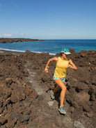 Women's Oiselle Flyout Trail Tank in Lemon/White, full-body trail-running view