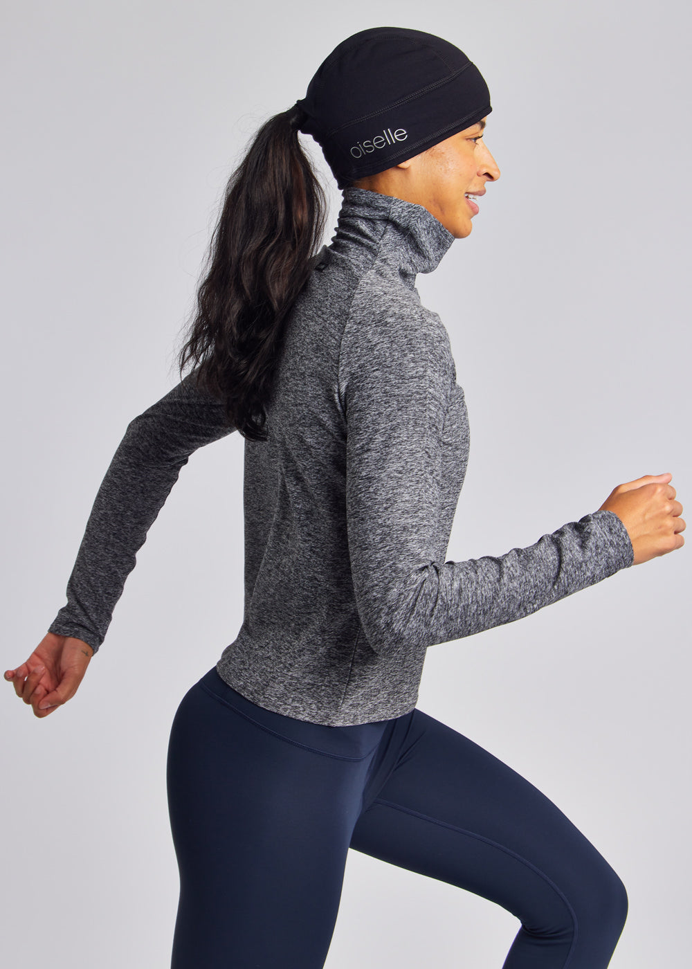 Women's Oiselle Power Move Beanie in Black, side and fit detail.