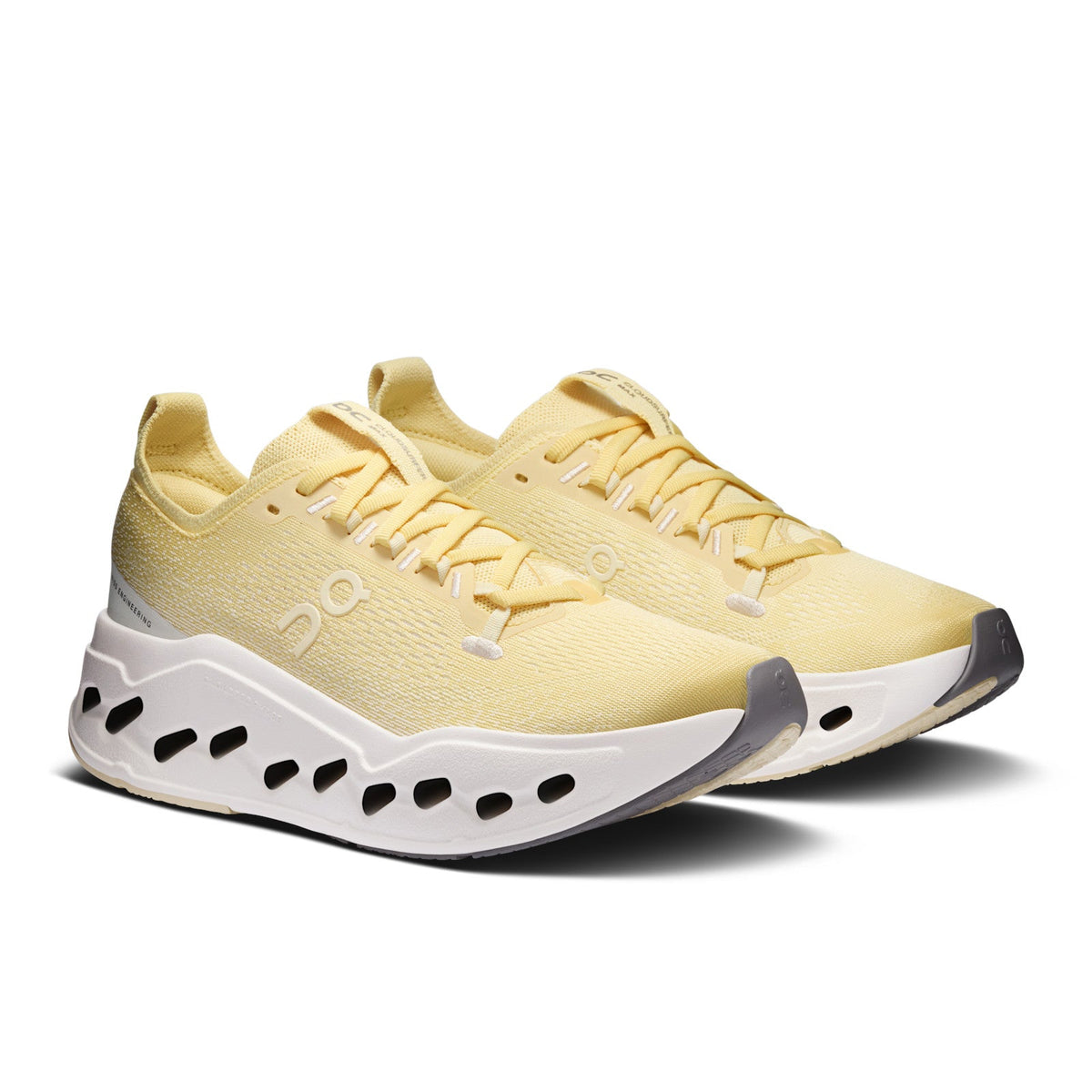 On Running Cloudsurfer Max women's running shoe in Dijon/Ivory — front three-quarter view of the pair
