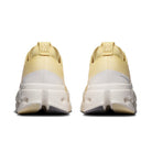 On Running Cloudsurfer Max women's running shoe in Dijon/Ivory — rear view of the pair