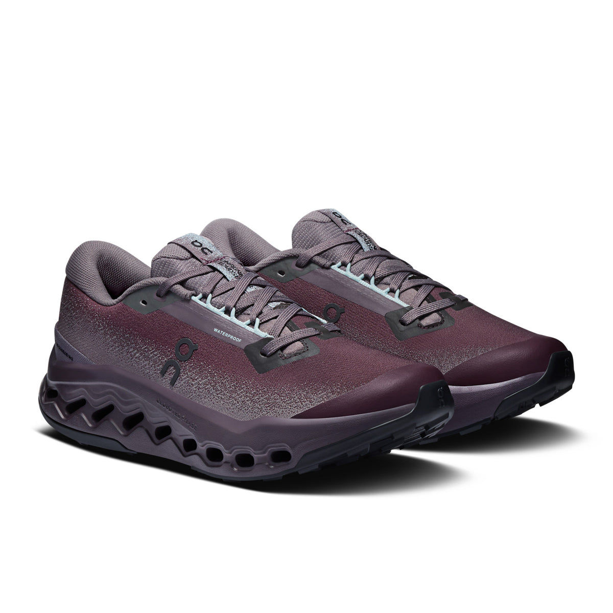 On Running Cloudsurfer Trail 2 Waterproof women's trail running shoe in Urchin/Pebble — front three-quarter view of the pair