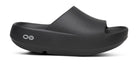 Unisex Oofos OOahh PLUS Slide in Black, lateral side view.