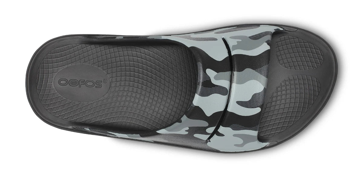 Unisex Oofos OOahh Sport Slide in Night Camo, top view.