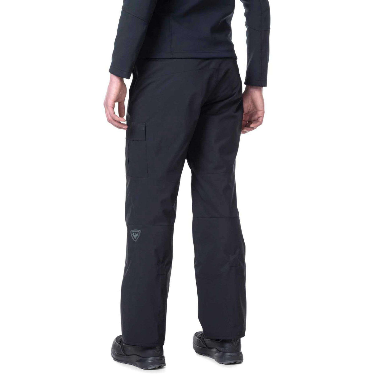 Person wearing black pants on a white background