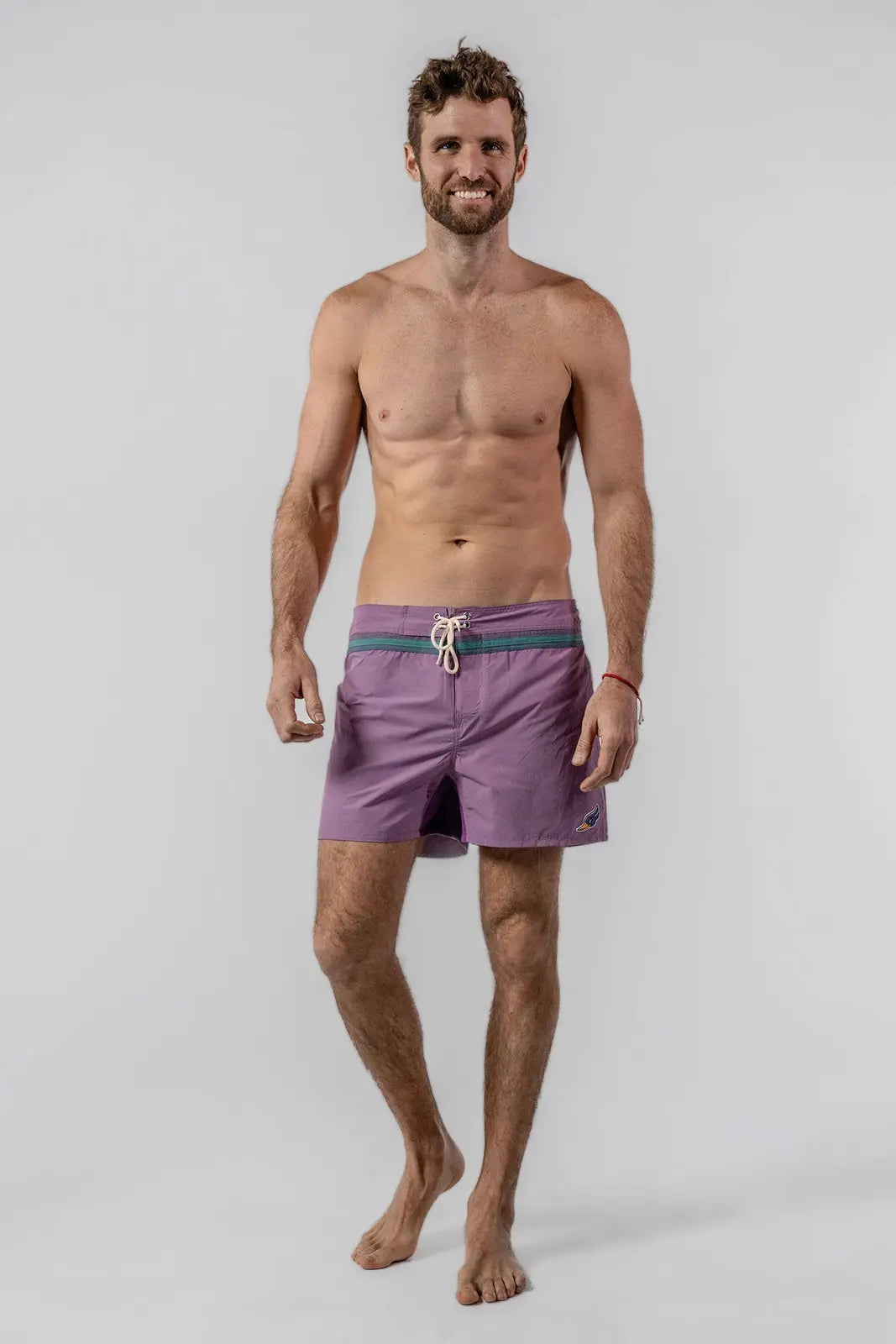 Woodpecker men's Pink/Lilac swim shorts shown from the front
