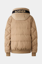 rear view of brown corduroy jacket with unzipped hidden "bogner" logo across hood in black and brown