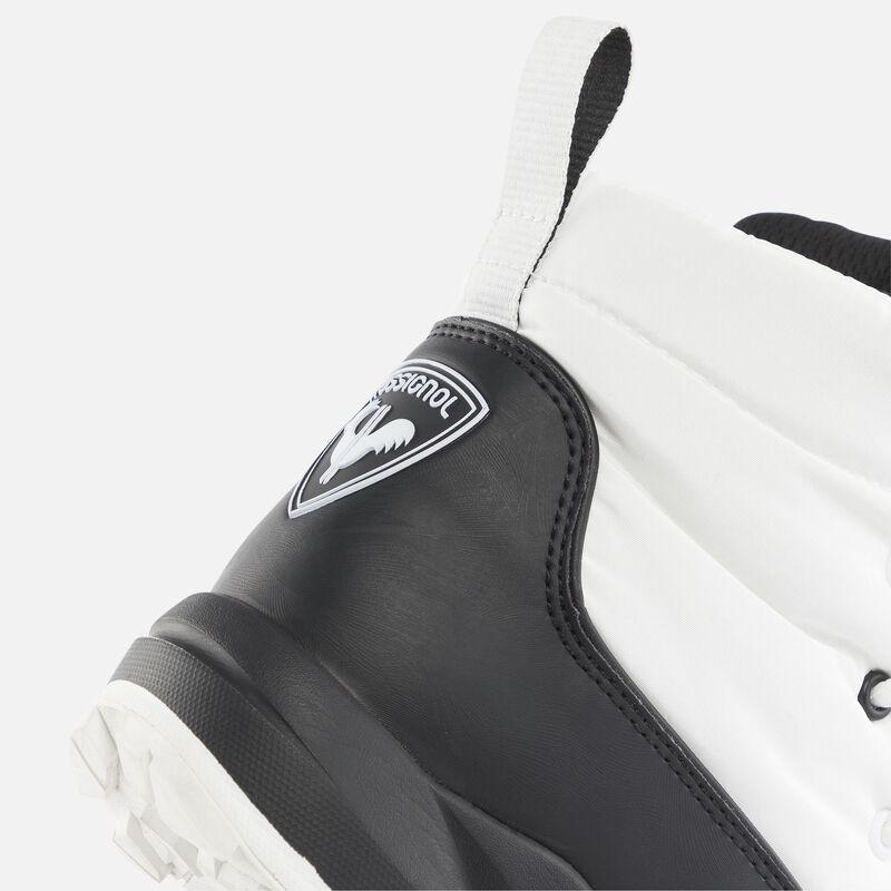 side view of the back of a white and black boot