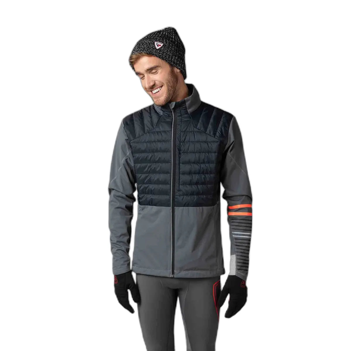 Person wearing a gray and black insulated jacket with a white background