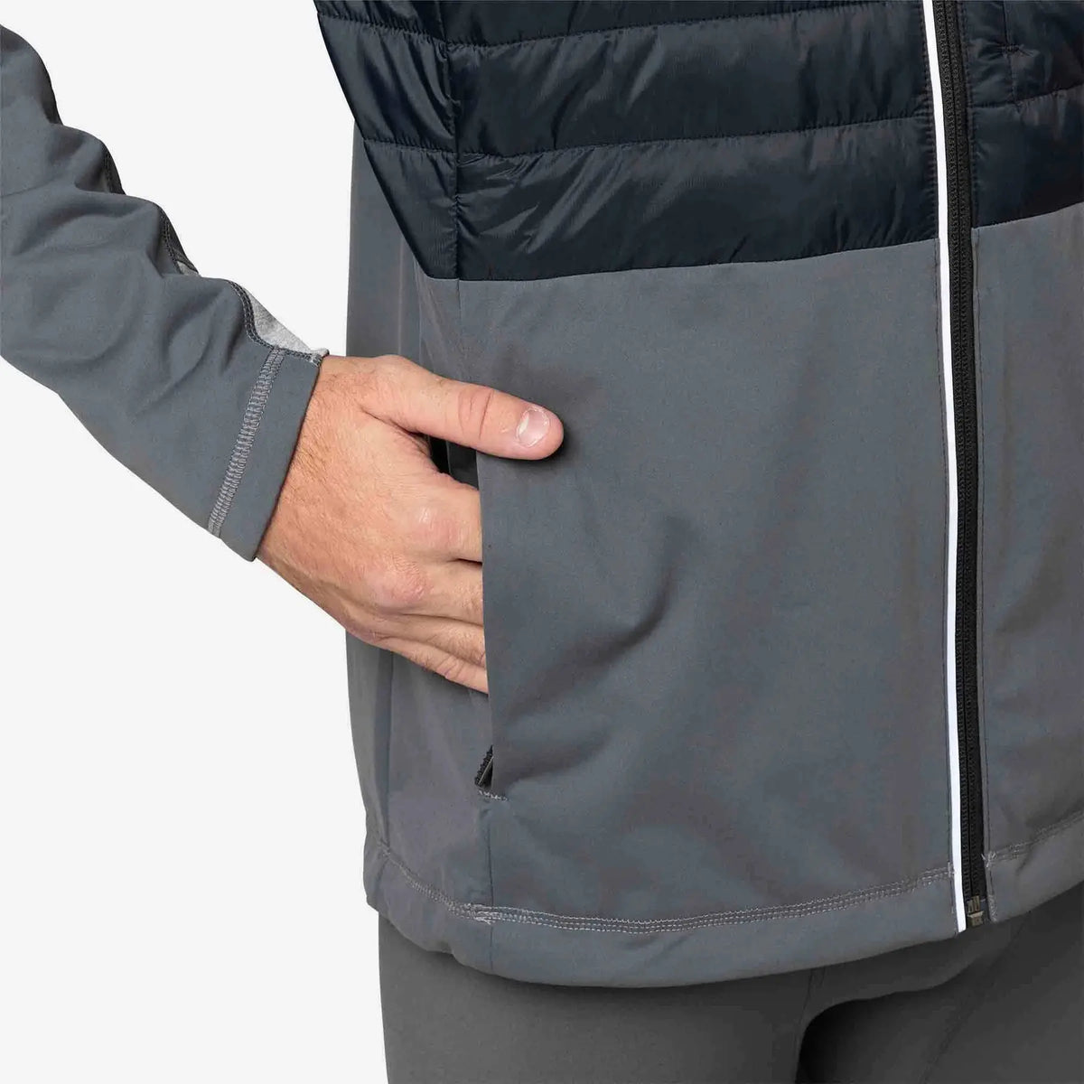 Gray and black jacket with a hand in the pocket on a light gray background