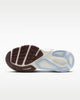 Close-up of a shoe sole with brown tread pattern on a white background
