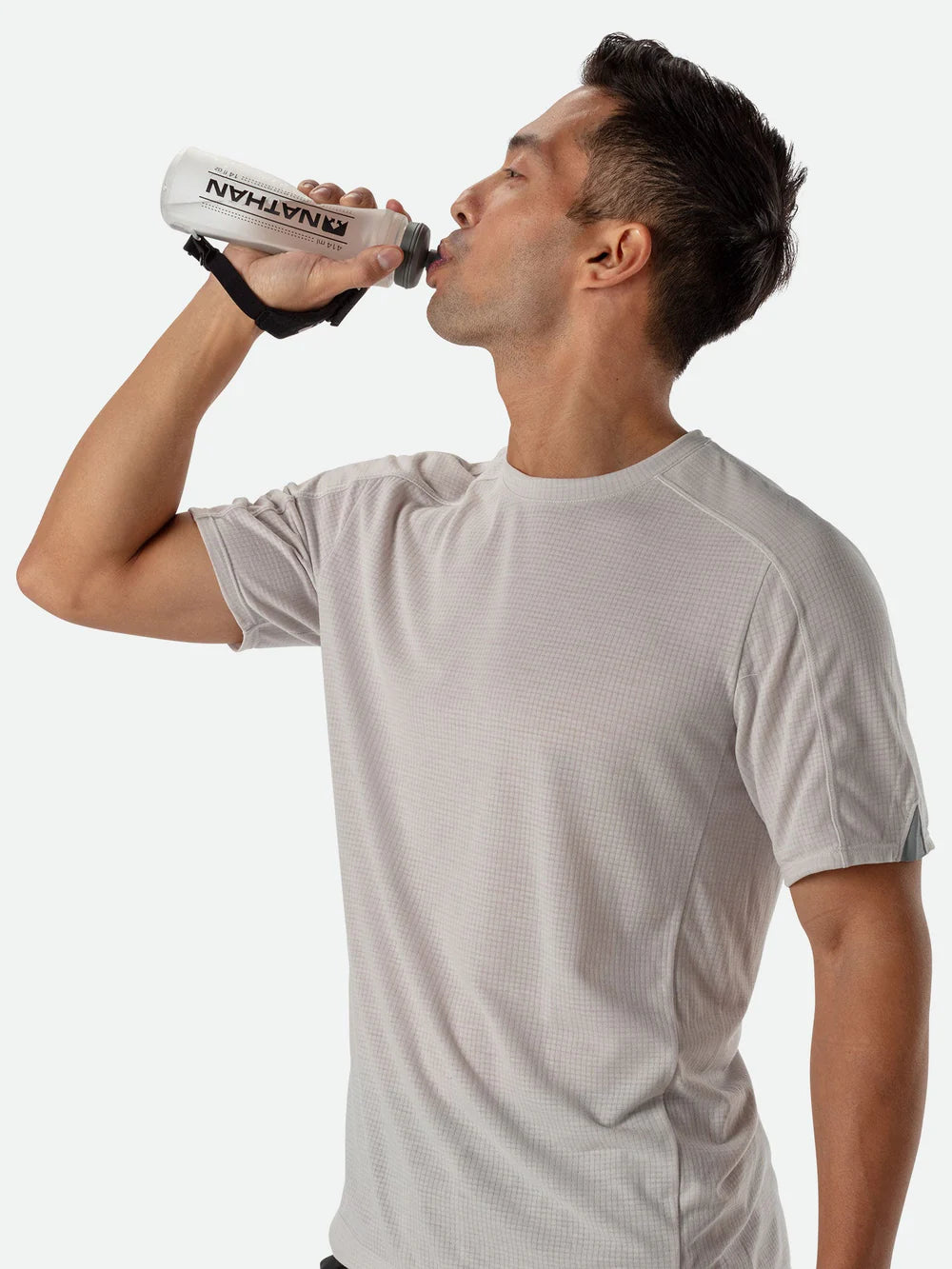 Nathan Pinnacle Lite 14 oz Black/Reflective Silver, shown in use
