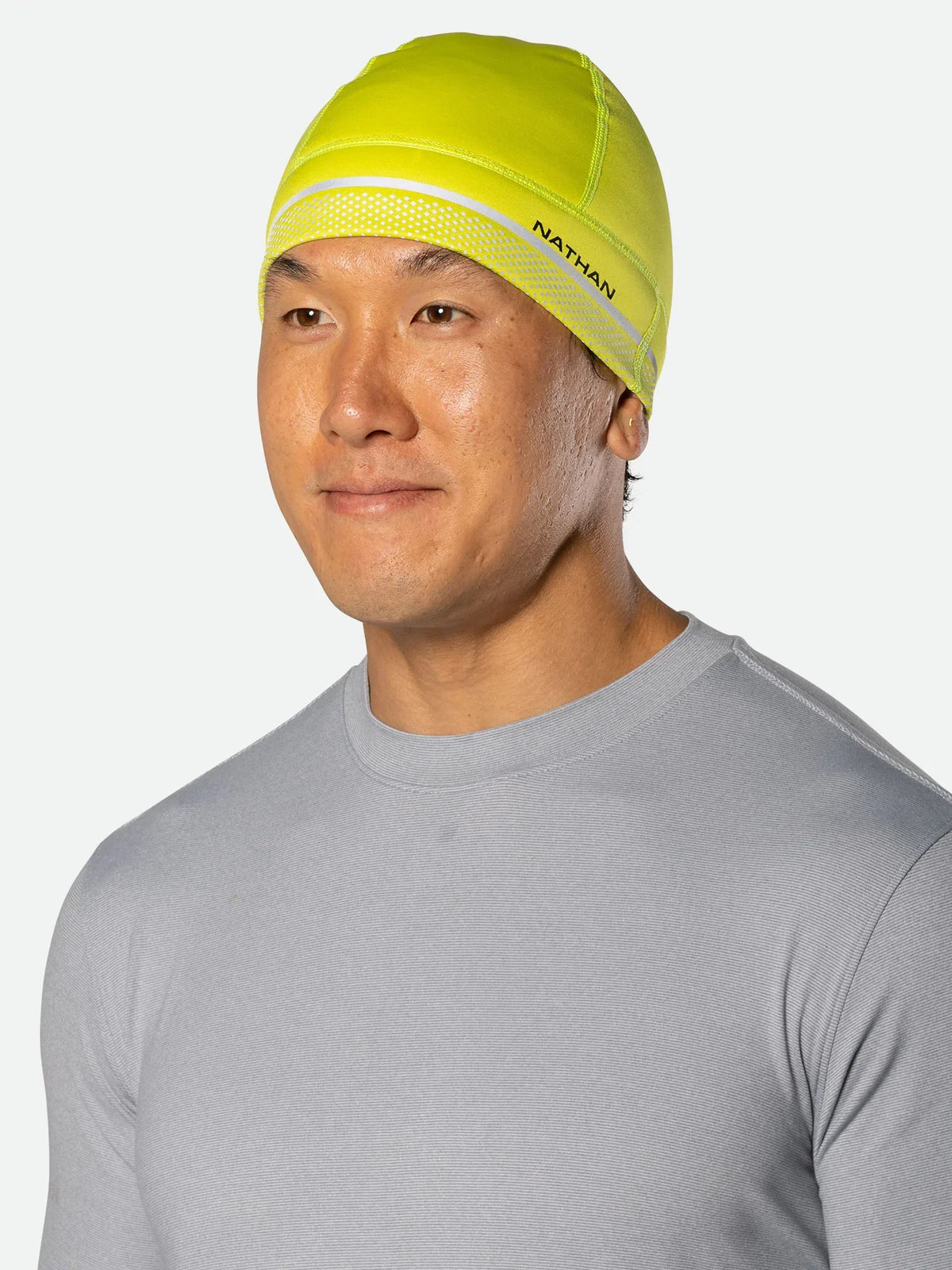 Nathan HyperNight Reflective Beanie, Hi Vis Yellow/Geo Print, front lateral view.