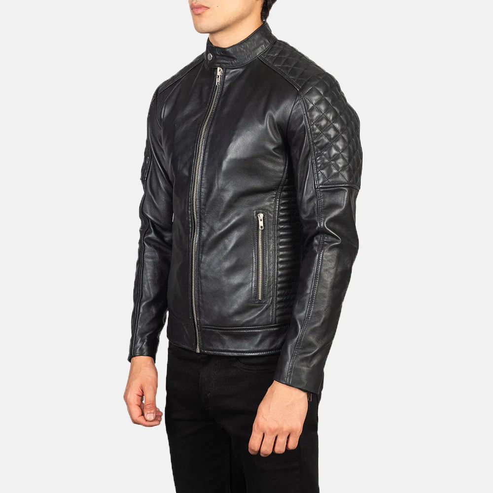 Black leather jacket with quilted details on a white background