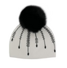 White beanie with black fur pom-pom and decorative beads on a white background
