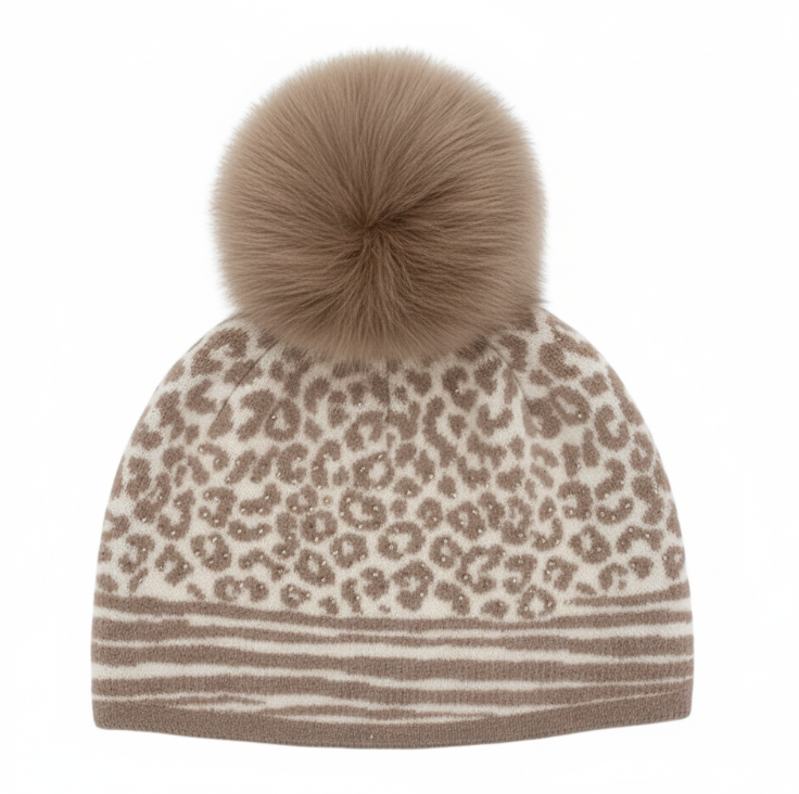Beige leopard print beanie with a large fur pom-pom on a white background