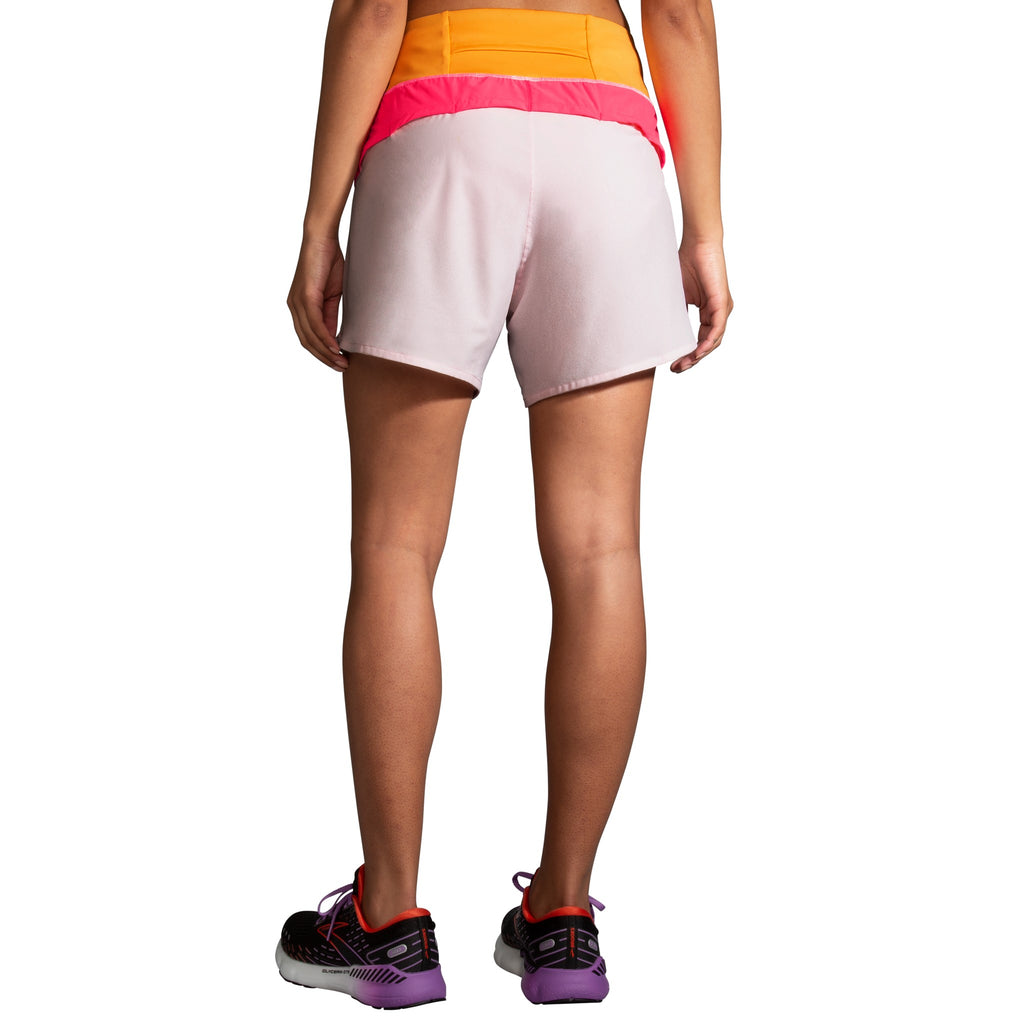 Women's Brooks Chaser 5" Shorts. White/Pink/Orange. Rear view.