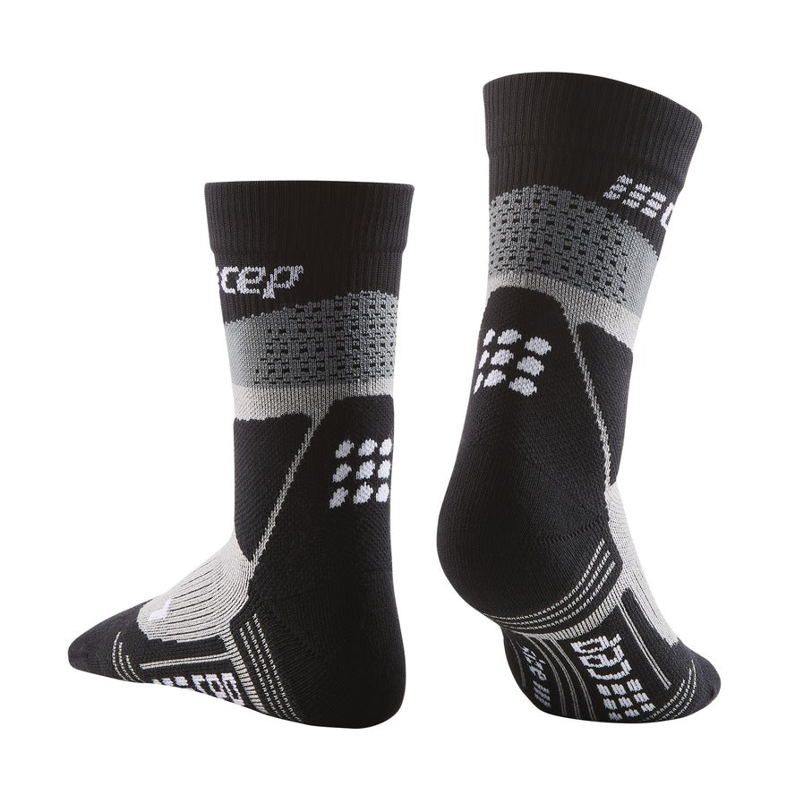 Men's CEP Max Cushion Mid Compression Socks. Black. Rear/Lateral view.