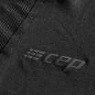 Women's CEP Run Shirt. Black. Logo closeup.