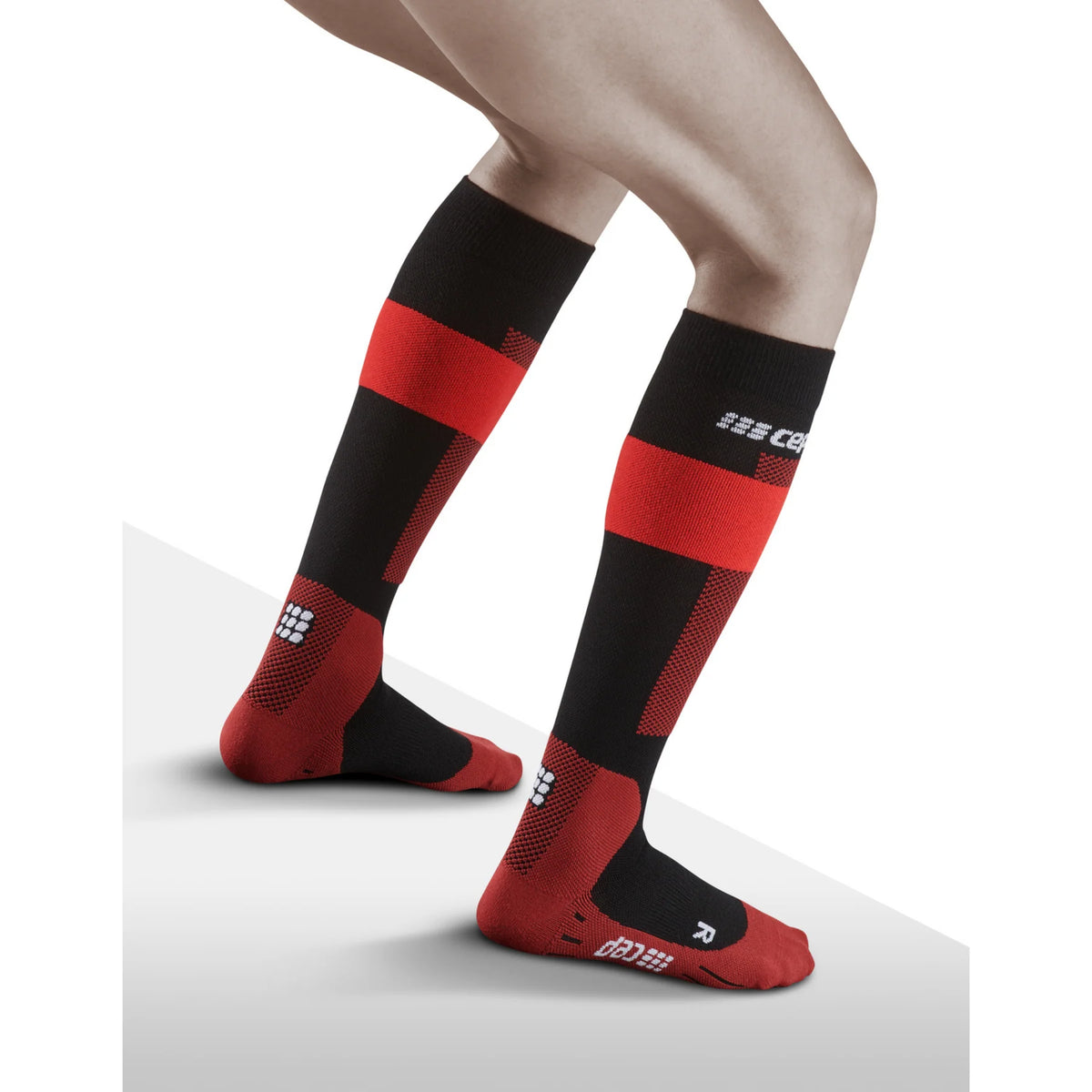 Women's CEP Ski Merino Compression Socks. Red/Black. Lateral view.