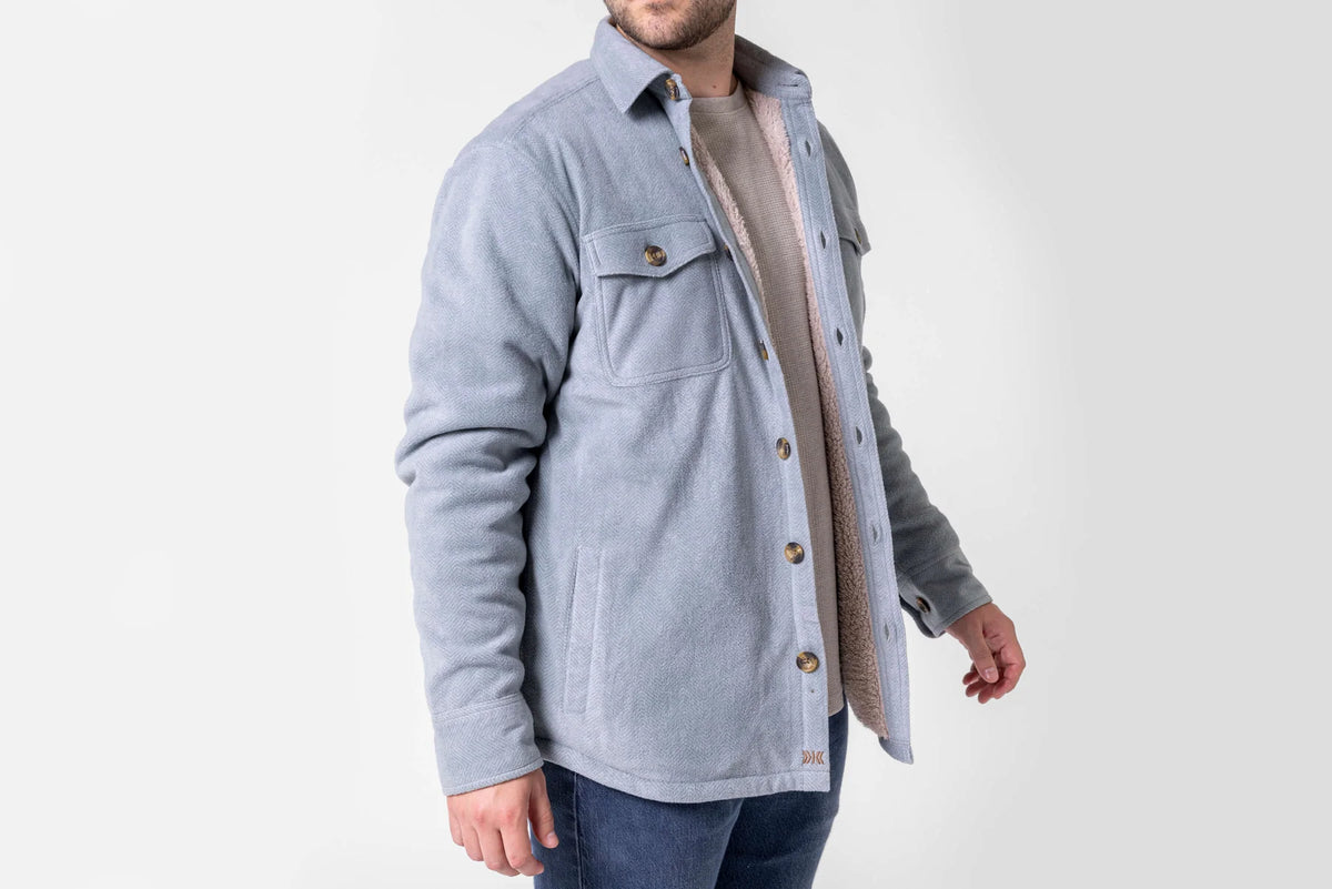Side view of Dakota Grizzly Rocco Silver Blue fleece jacket showing sherpa lining and hand pocket