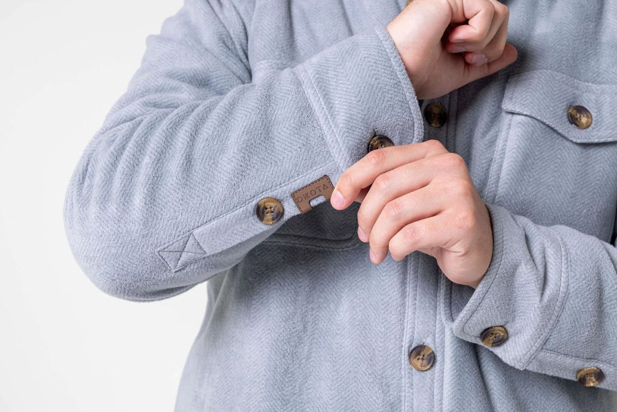 Dakota Grizzly Rocco Silver Blue jacket cuff showing two buttons and branded DKOTA tab