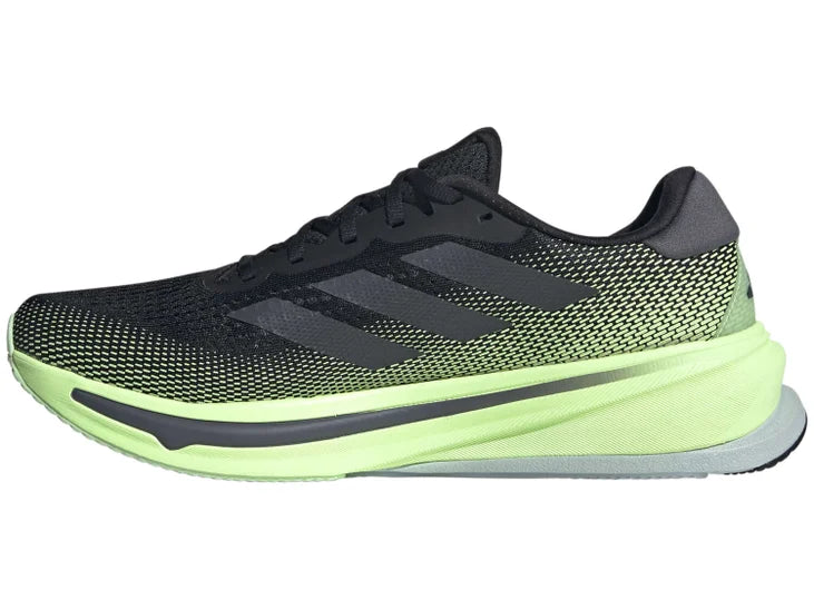 Men's Adidas Supernova Rise - majority black shoe with a bright green fade and green midsole. Medial Side of shoe
