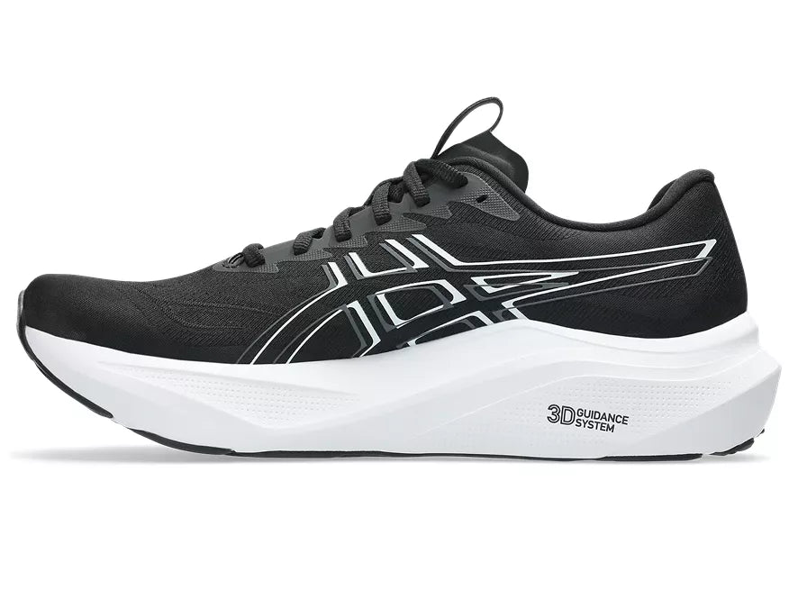Men's Asics GT 2000 14. Black upper. White midsole. Medial view.