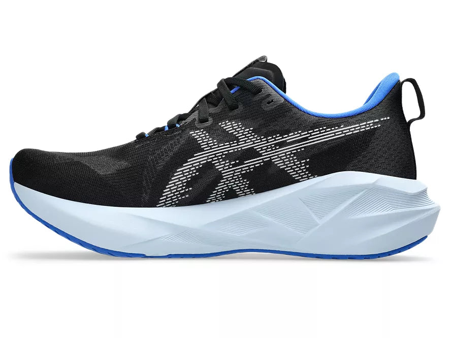 Men's Asics Novablast 5. Black upper. White midsole. Medial view.