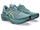 Men's Asics Novablast 6. Green upper. Green midsole. Lateral view.
