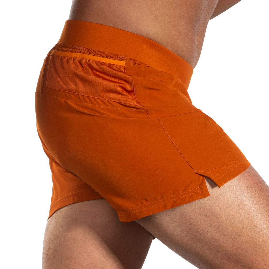 Men's Brooks Sherpa 5" Shorts. Dark Orange. Lateral view.
