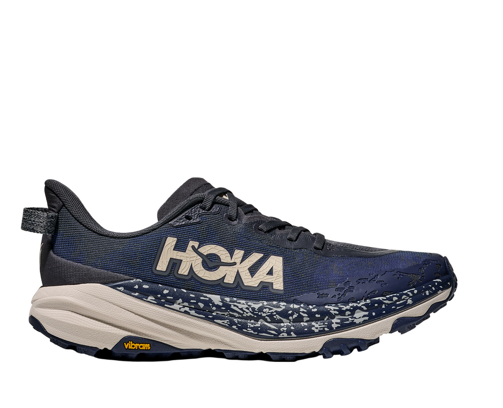 Men's Hoka Speedgoat 6. Navy blue upper. Cream midsole. Lateral view.